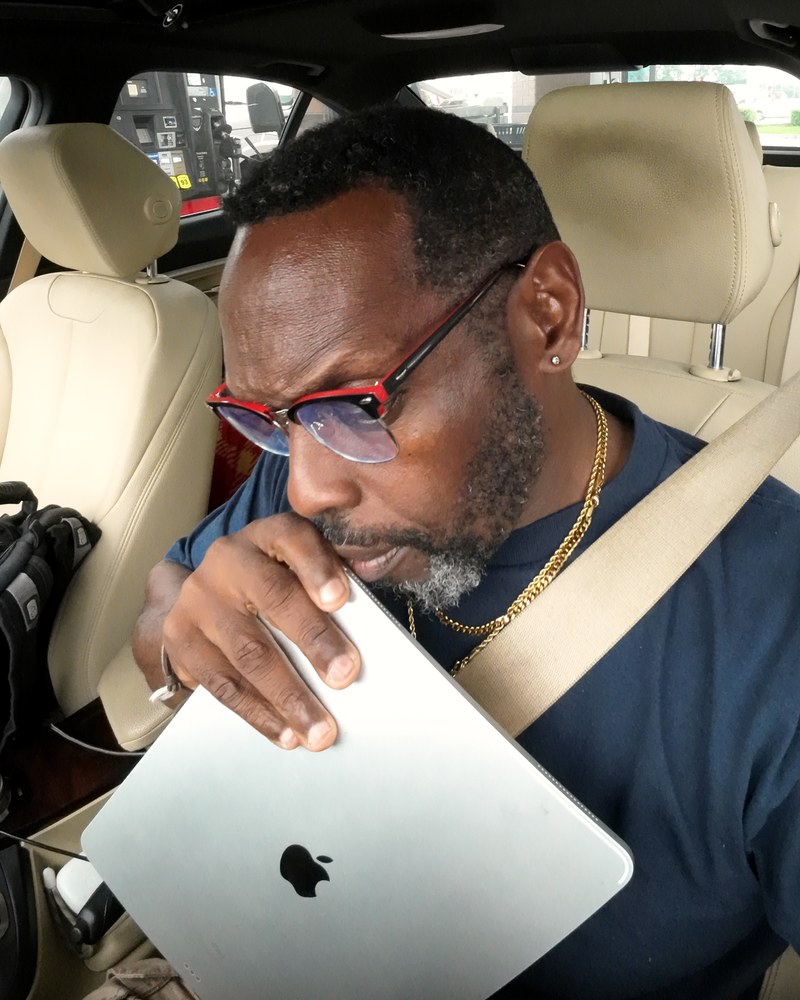 Mauriel, founder of Golden Hour Talent, working on a laptop