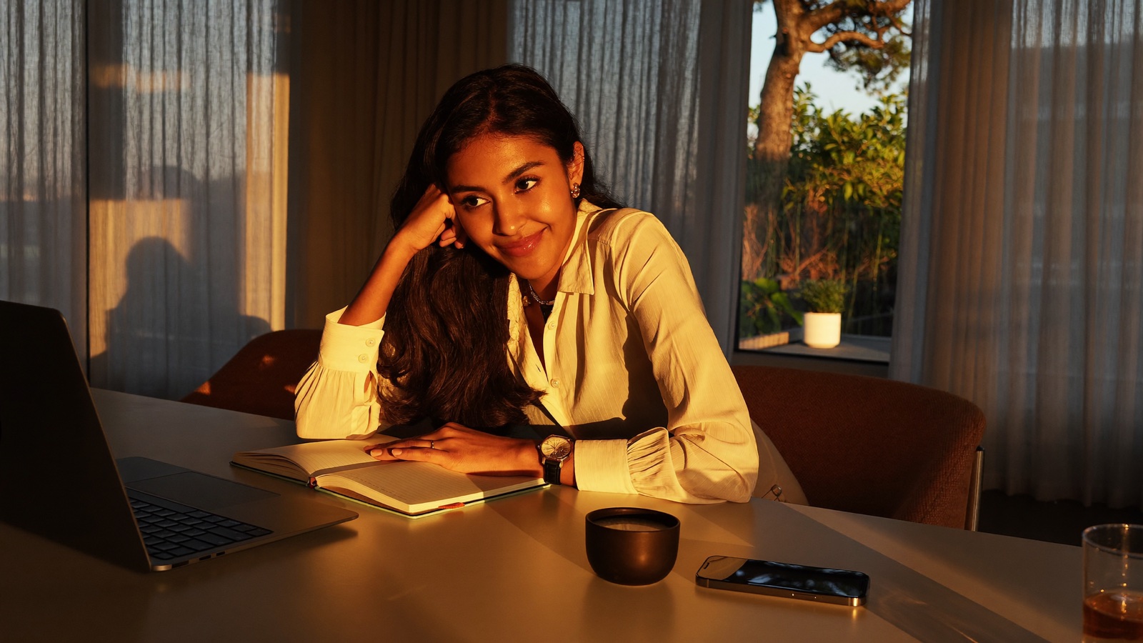 A creator planning in warm evening light