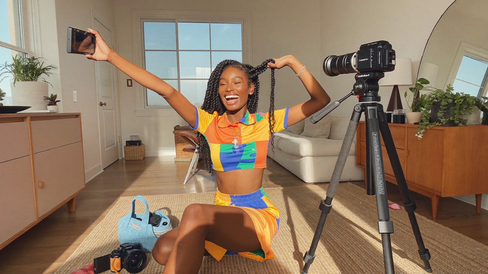 A creator filming while her team handles everything else